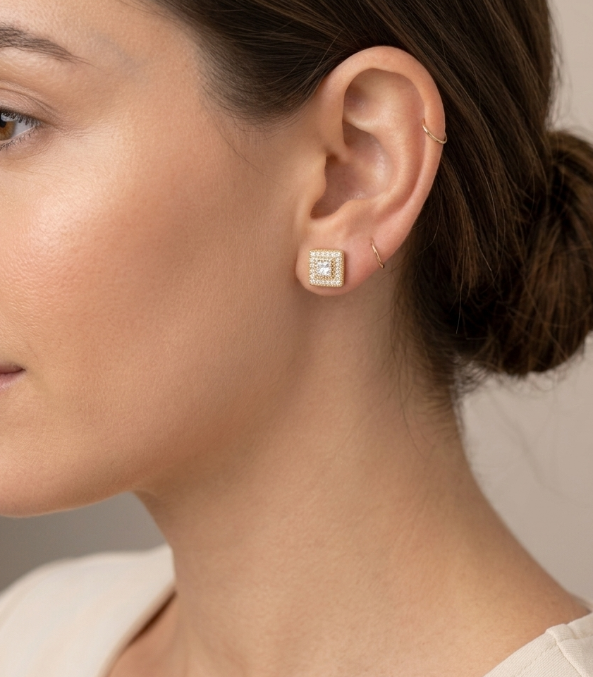 Big Daddy Rebirth diamond cut earring worn on ear, showing square stud design