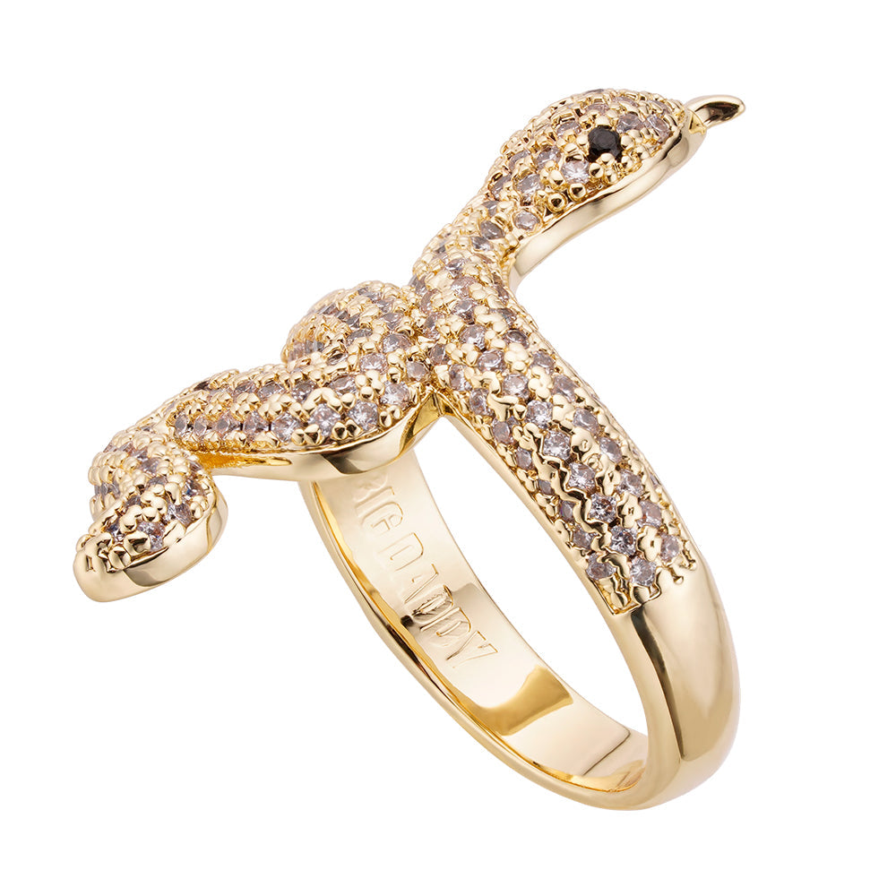 Gold snake ring with diamond pavé setting, wrapped design with black onyx eyes