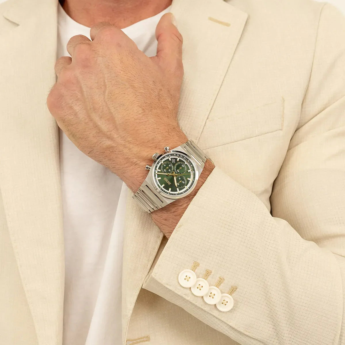 BOSS stainless steel chronograph watch on wrist over beige blazer