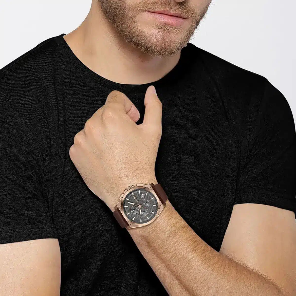 BOSS Grandmaster watch worn on wrist showing rose-gold case and gray dial