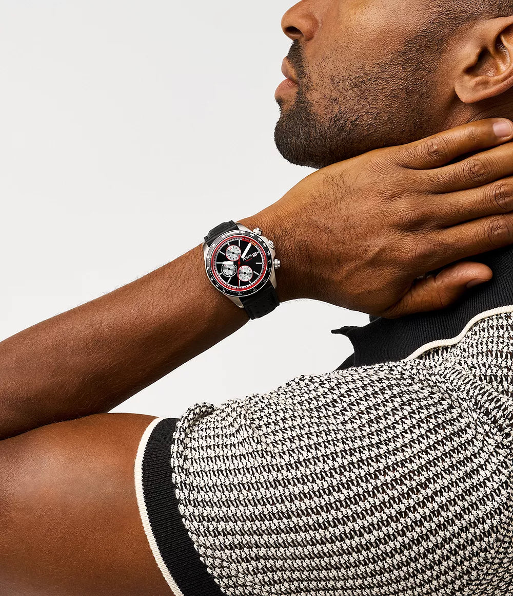 Fossil Autocross BQ2888 chronograph watch worn on wrist with black dial and red bezel detail