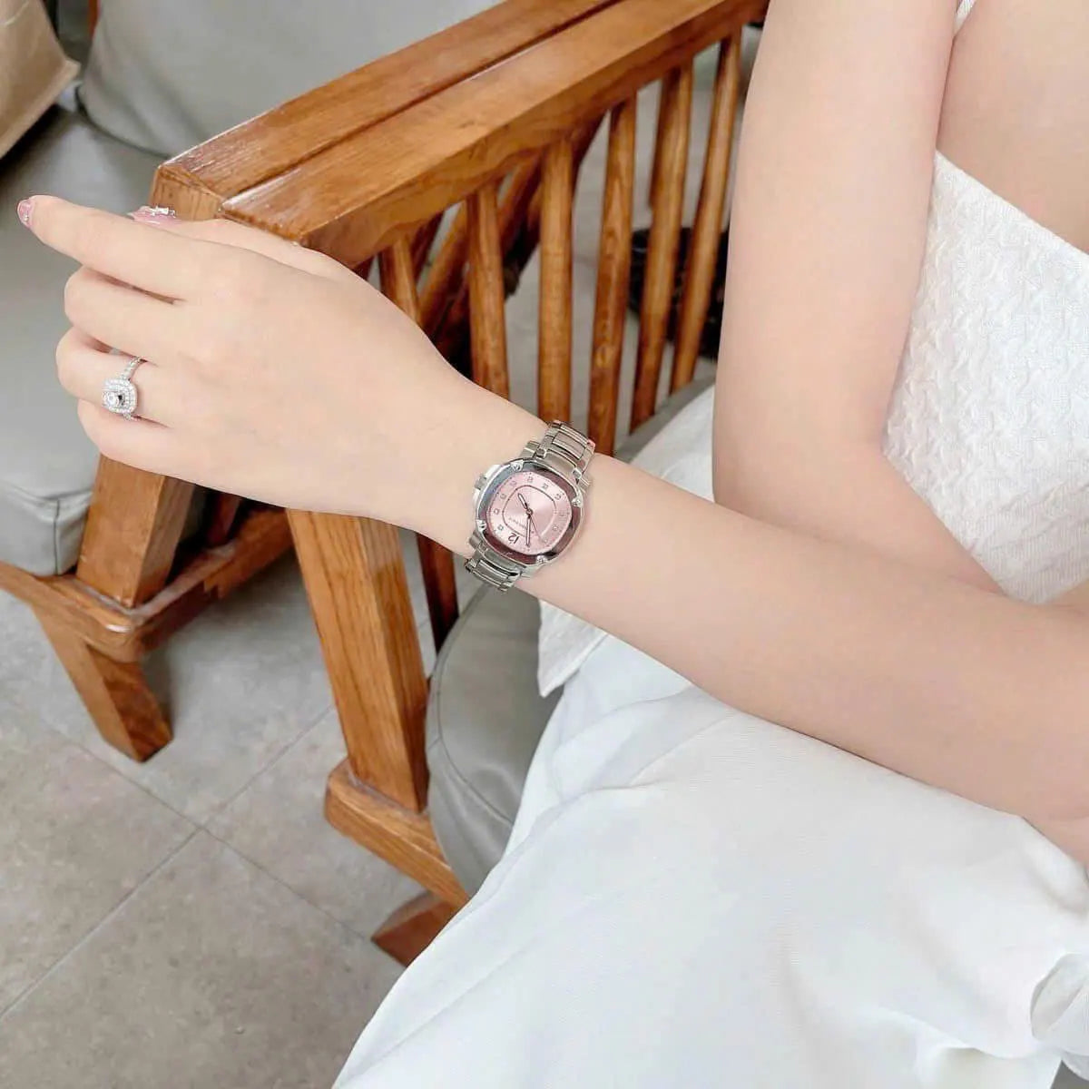 Burberry Britain pink dial watch worn on woman's wrist