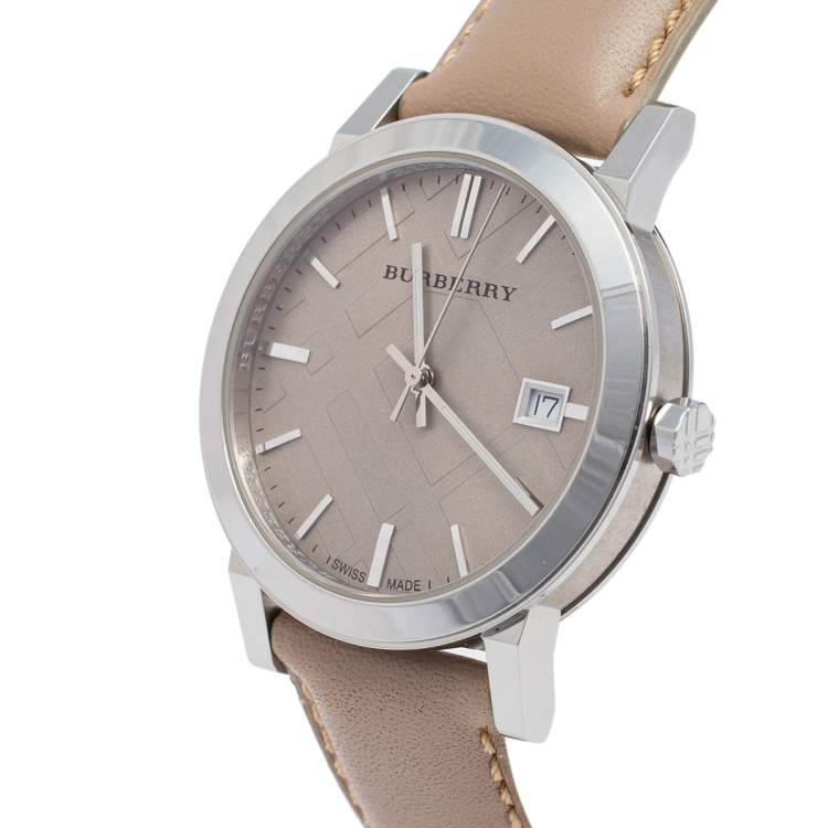 Burberry BU9010 watch angled view showing dial, bezel and tan leather strap