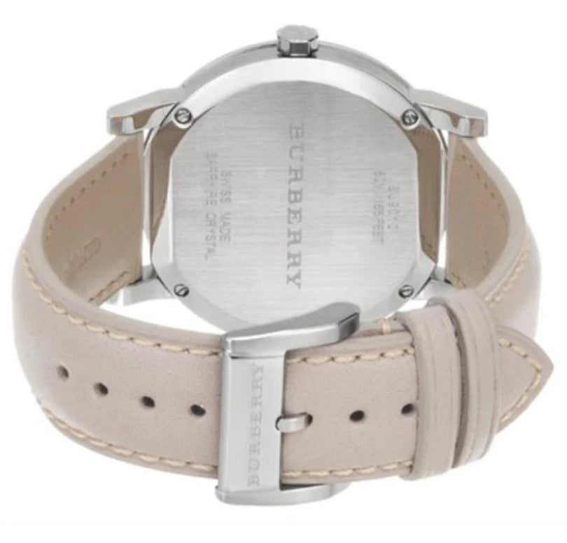 Burberry BU9010 caseback showing stainless steel back and tan leather strap