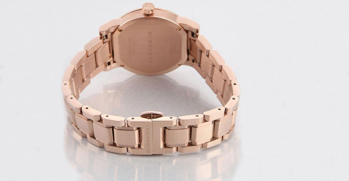 Rose gold stainless steel case back with link bracelet visible