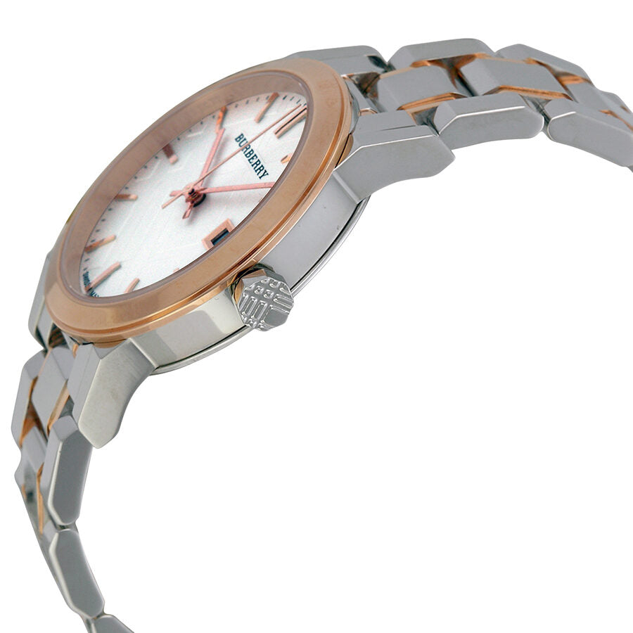 Burberry BU9105 watch from side angle displaying rose gold case and two-tone bracelet construction