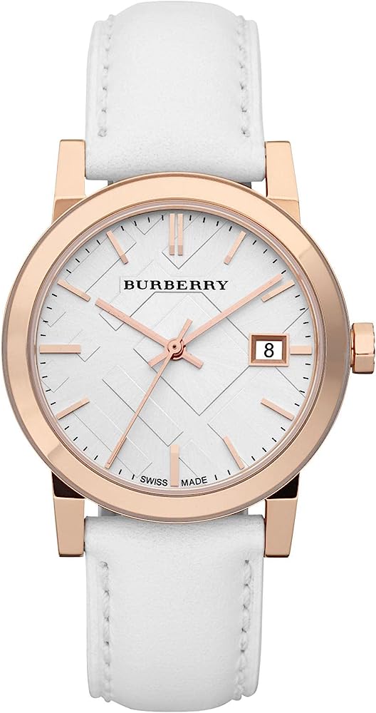 Burberry rose gold case women's watch with white dial, rose gold indexes, white leather strap, and date window