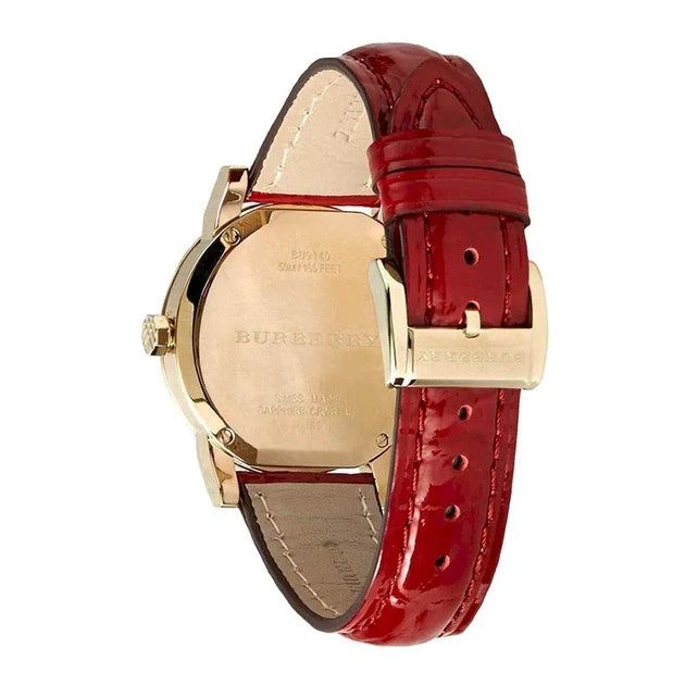 Burberry BU9140 watch caseback showing gold case back with branding and red patent leather strap