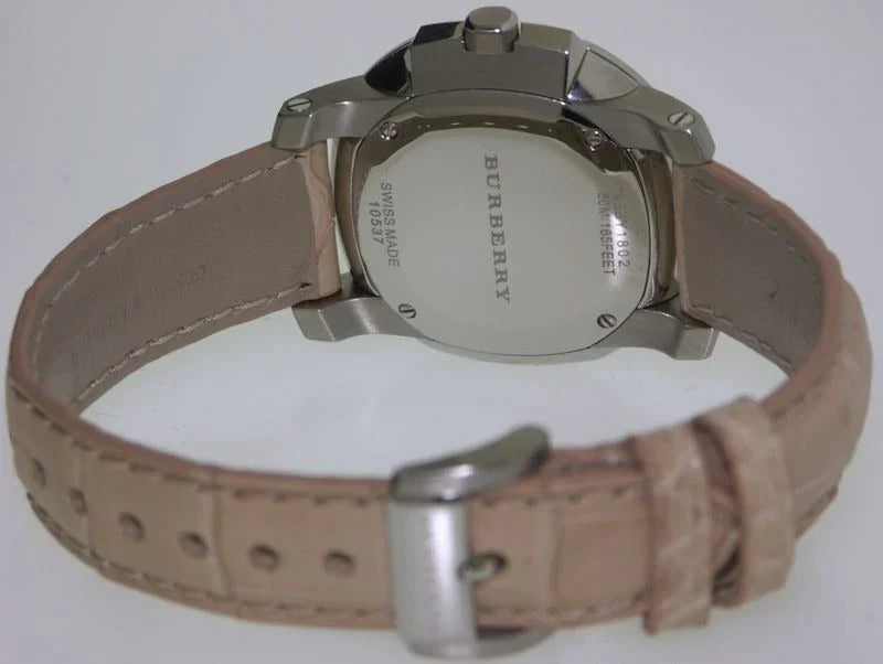 Burberry The Britain Diamonds watch worn on wrist with pink leather strap