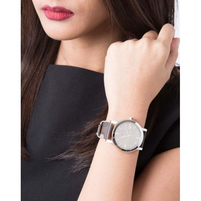 Burberry The City watch worn on wrist with grey dial and brown leather strap