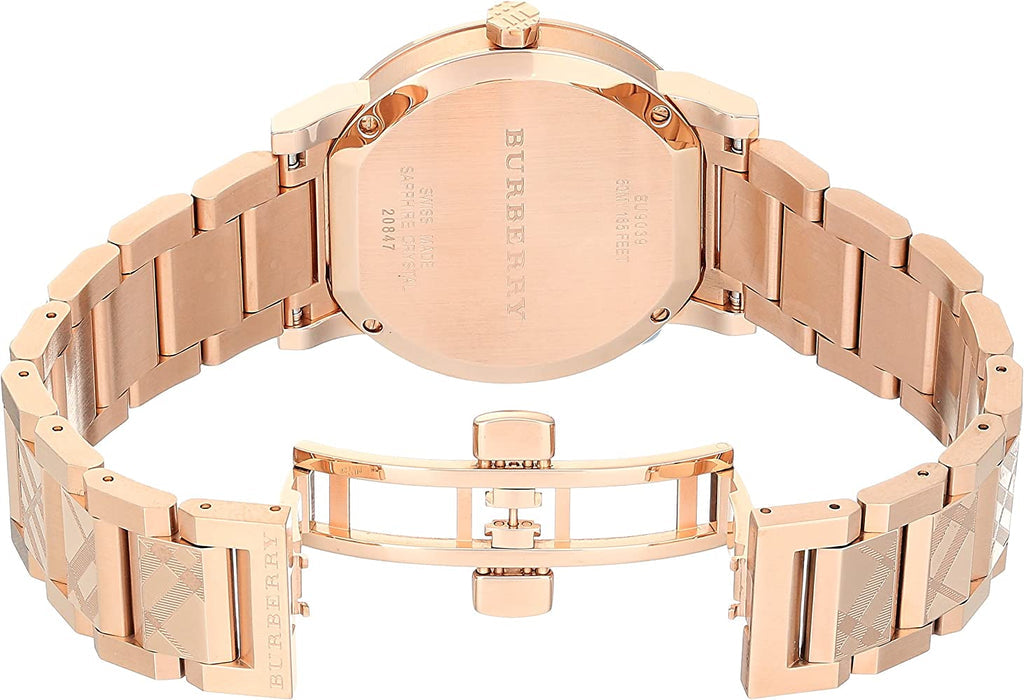 Burberry The City rose gold watch caseback showing engraved details and bracelet