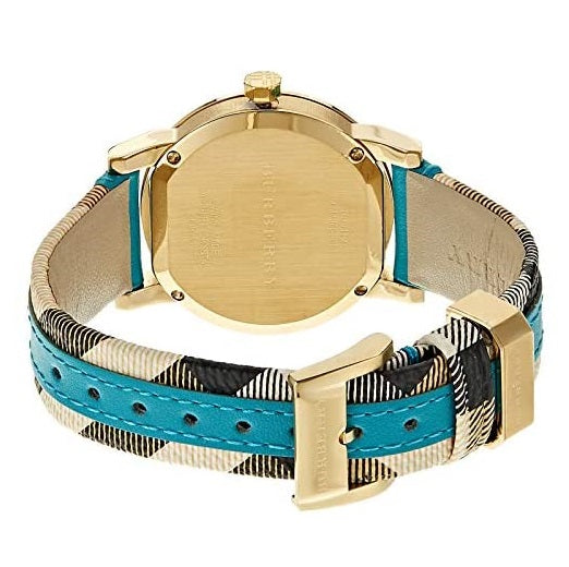 Burberry The City watch caseback showing gold-tone back with turquoise leather and check pattern strap