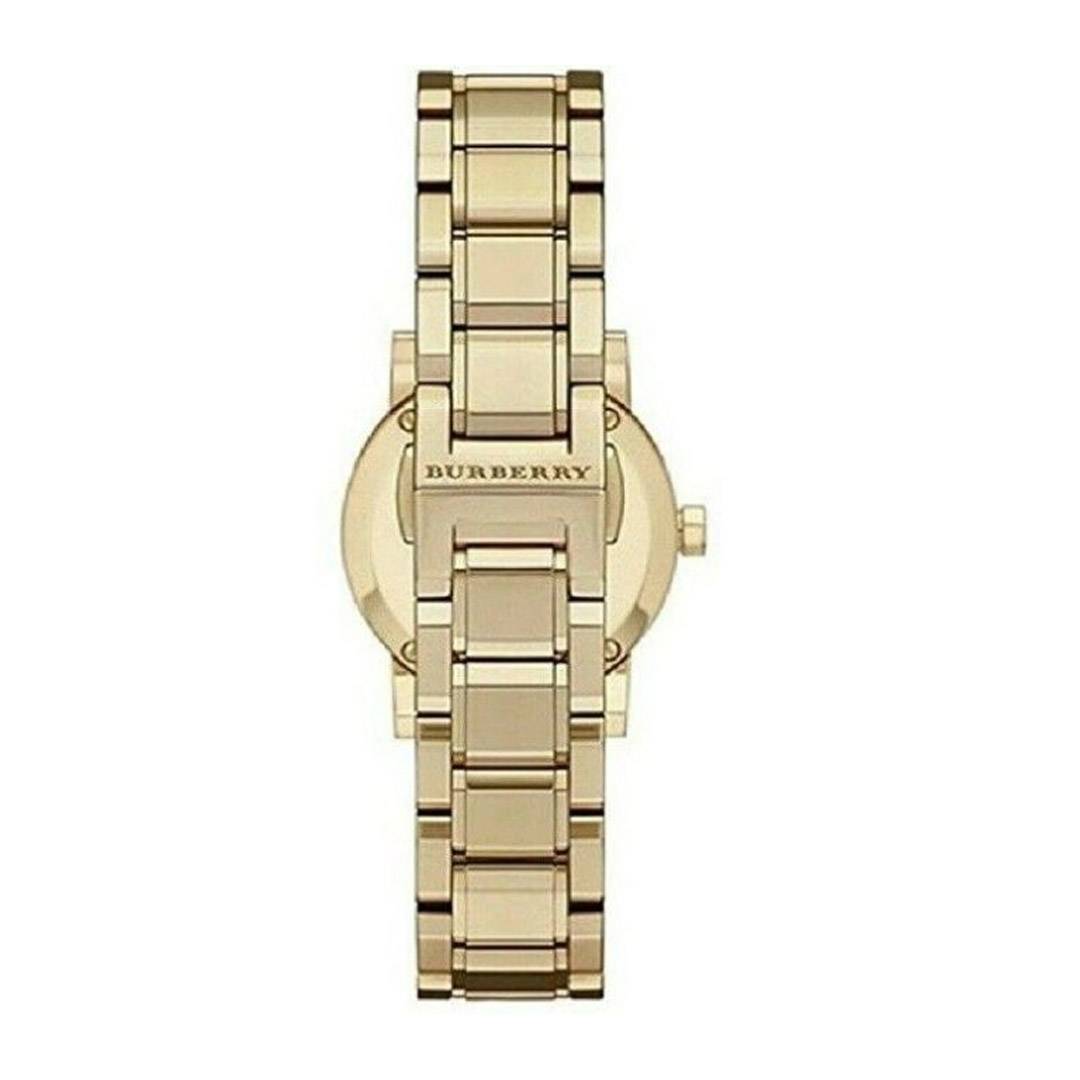 Caseback view of Burberry The City gold-tone women's watch with engraved Burberry logo