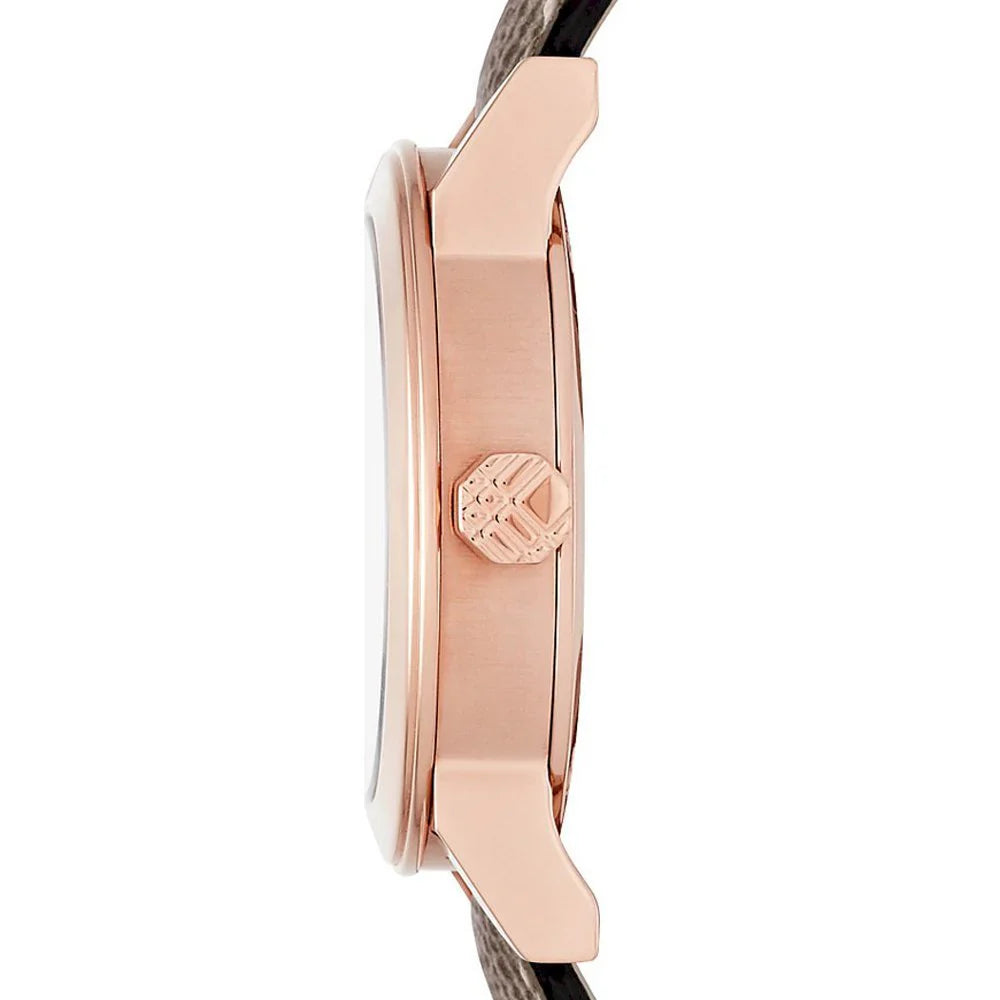 Side profile of Burberry The City watch showing rose gold case and striped leather strap