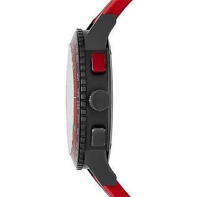 Side profile of watch showing crown, chronograph pushers, and red rubber strap attachment