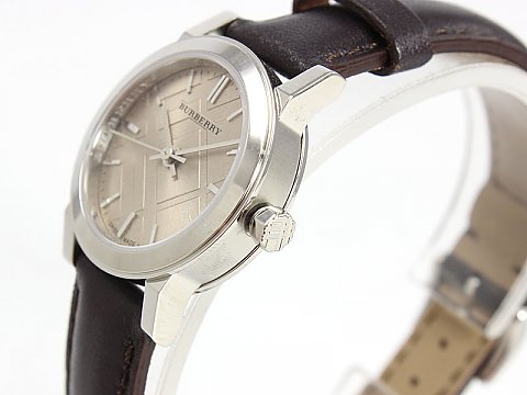 Side angle view of Burberry The City Nova watch with stainless steel case and brown leather strap