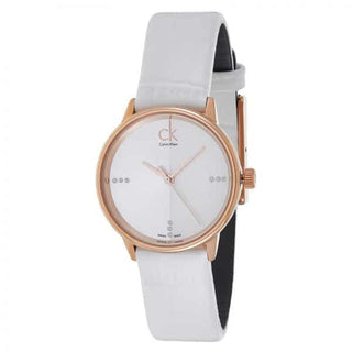 Calvin Klein Accent women's watch at angle showing rose gold case and white strap