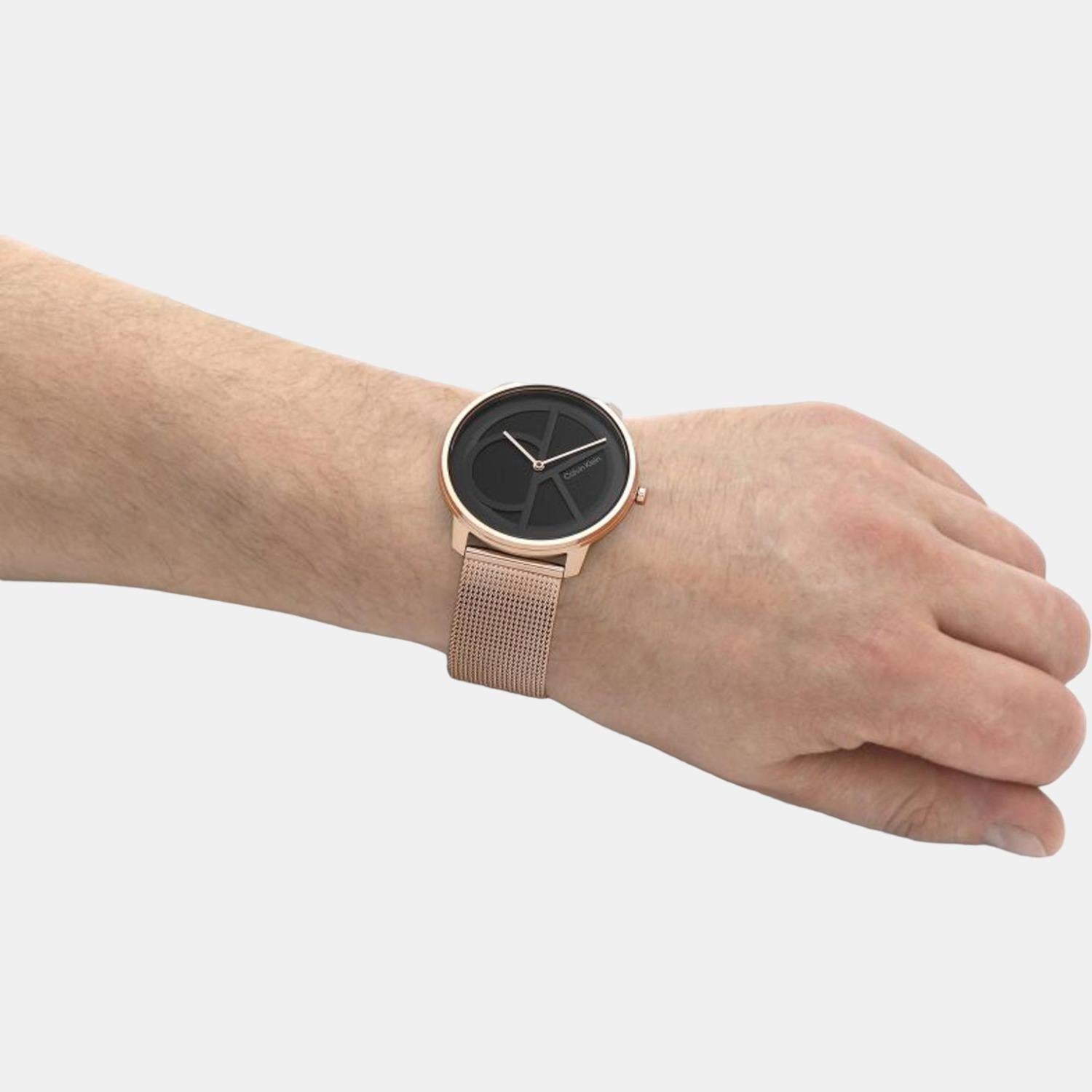 Calvin Klein Carnation Gold watch worn on wrist with gold mesh strap