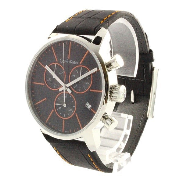 Side angle view of Calvin Klein City chronograph showing stainless steel case and black leather strap with orange stitching