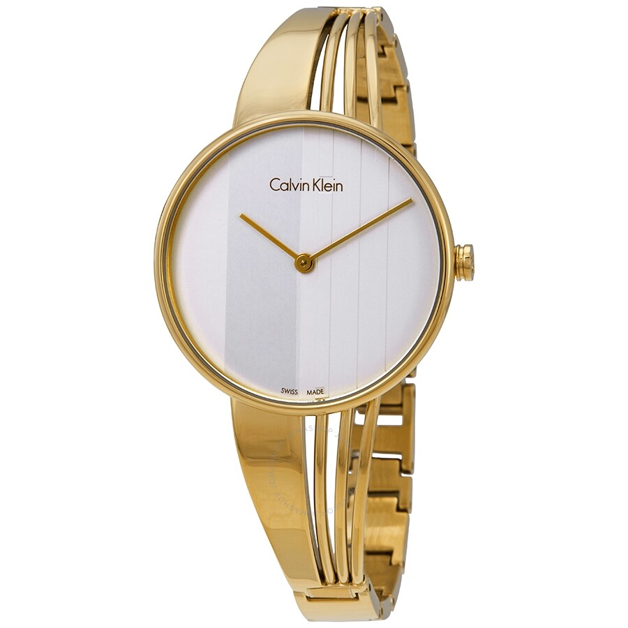 Gold bangle bracelet watch with silver dial and vertical stripe pattern