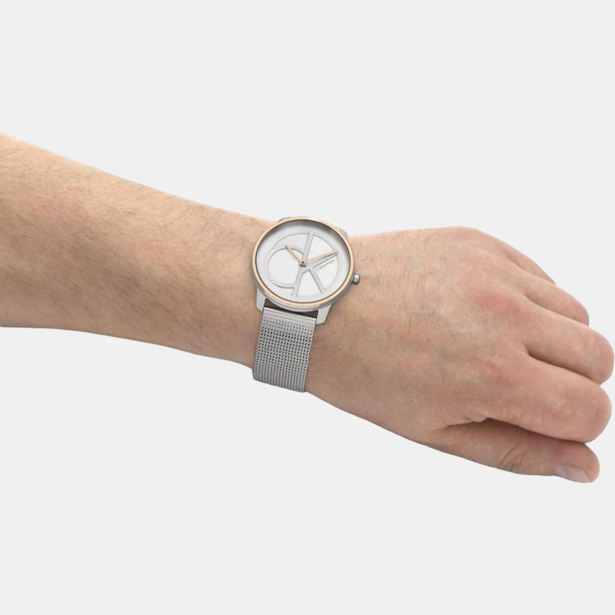 Calvin Klein Iconic watch on wrist showing minimalist dial and mesh strap