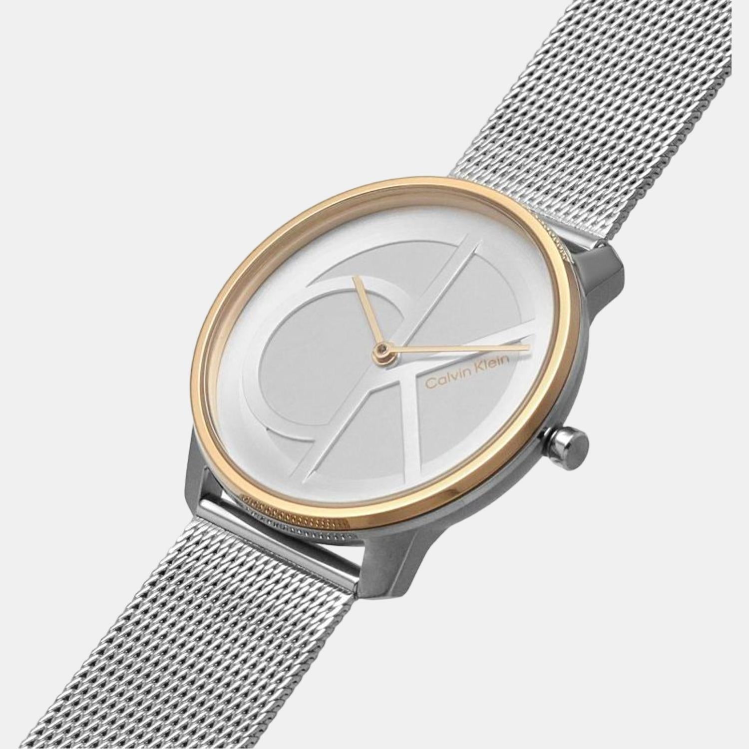 Calvin Klein Iconic unisex watch worn on wrist with silver mesh band