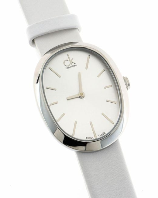 Calvin Klein Incentive watch side view showing case thickness and white leather strap