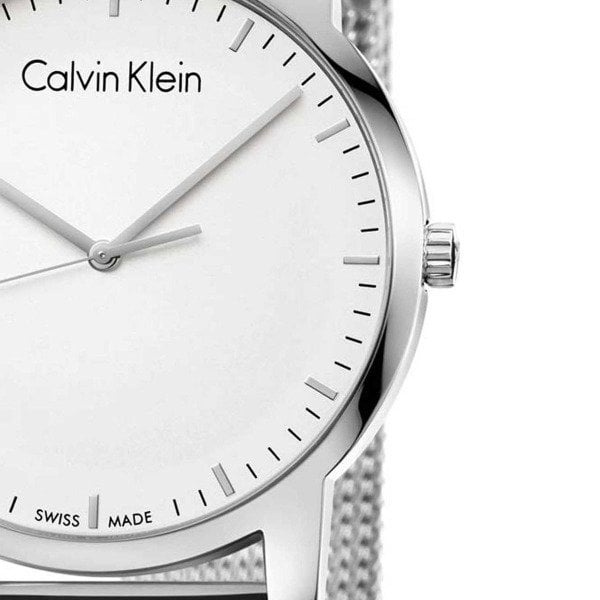 Side view of Calvin Klein City watch dial with crown and mesh band detail