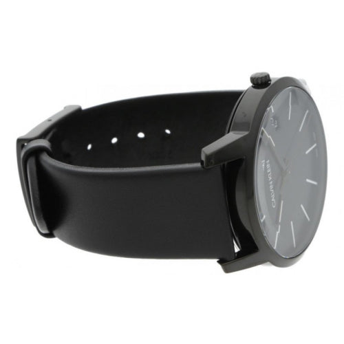 Calvin Klein men's watch worn on wrist with black strap and black dial