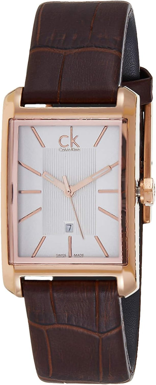Calvin Klein K2M23620 at angle showing rectangular rose gold case, brown leather strap, white dial