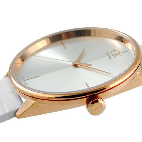 Overhead view of Calvin Klein watch on white strap showing full dial design