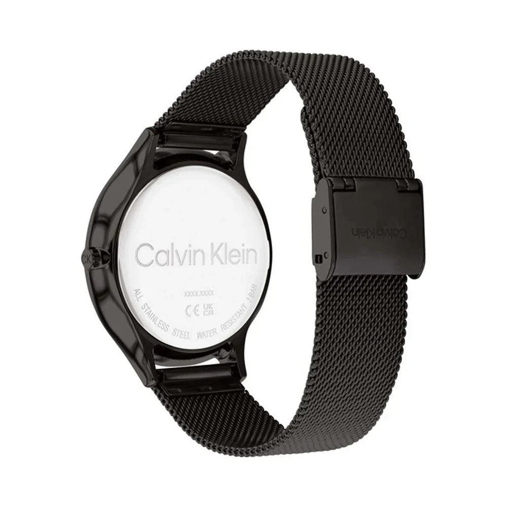 Calvin Klein minimalist watch caseback showing engraved logo and mesh strap attachment