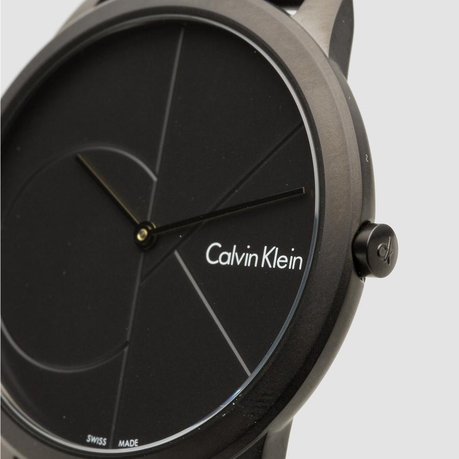Close-up of Calvin Klein K3M524B1 black dial with minimalist design and indices