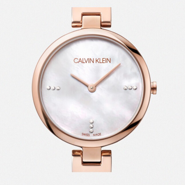 Dial detail showing silver face with rose gold hour markers and hands