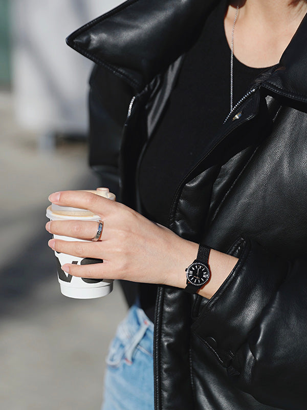 Calvin Klein Minimal Diamonds watch worn on wrist with black mesh bracelet
