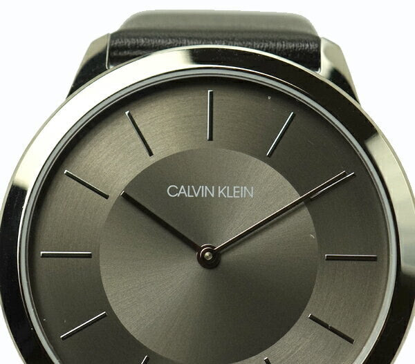 Close-up of Calvin Klein Minimal watch dial with sunburst finish and minimalist applied hour markers