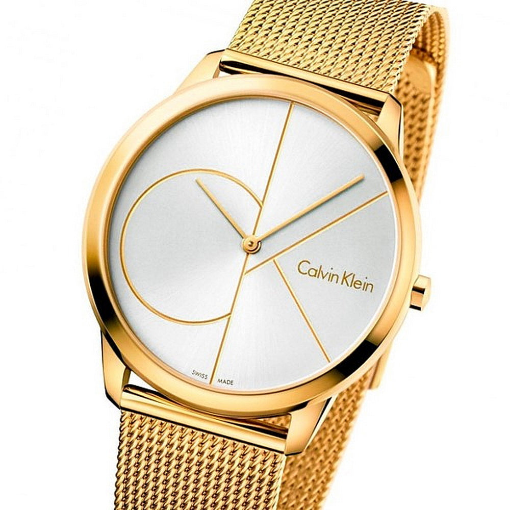 Calvin Klein Minimal 40mm watch at angle showing gold steel case, white dial with geometric pattern, gold mesh strap