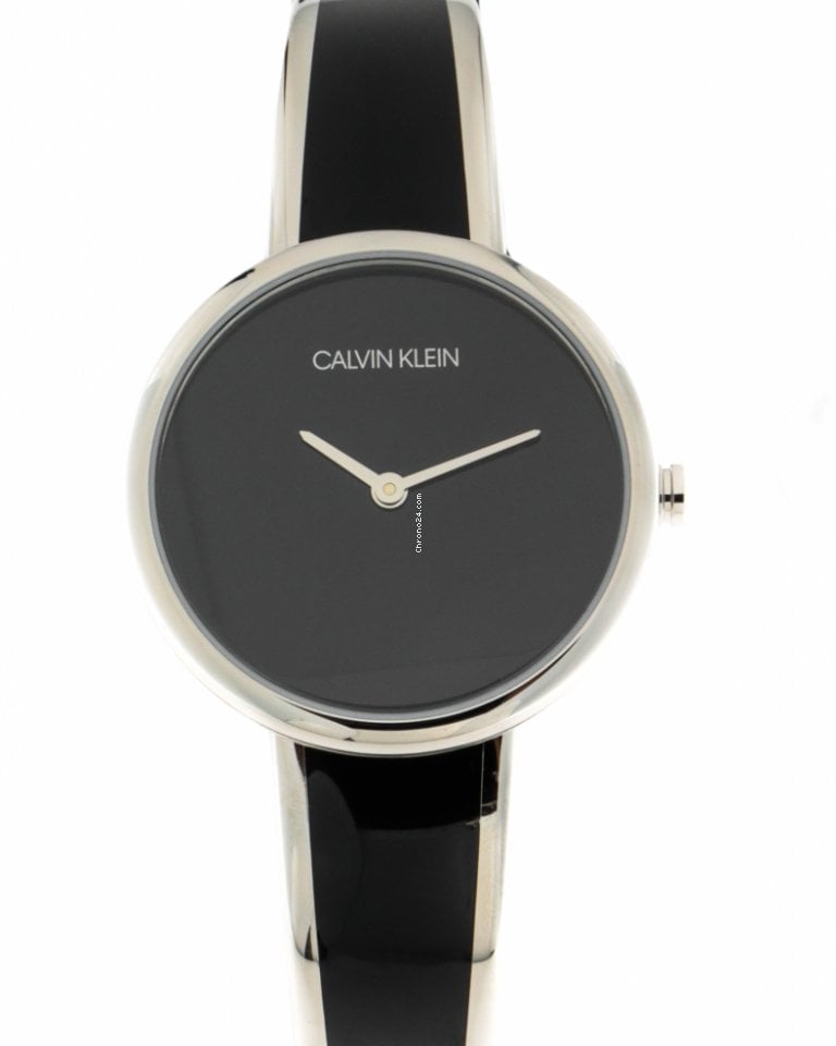 Calvin Klein Seduce watch angled view showing black and silver two-tone design
