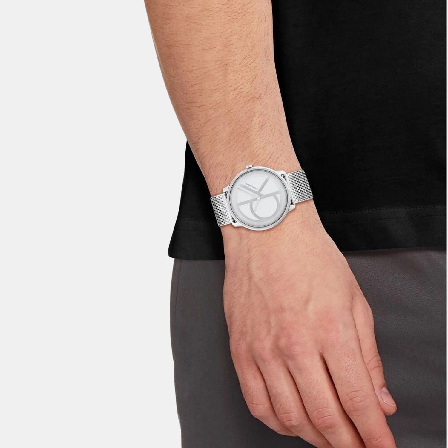 Calvin Klein Stately men's watch worn on wrist with silver mesh strap