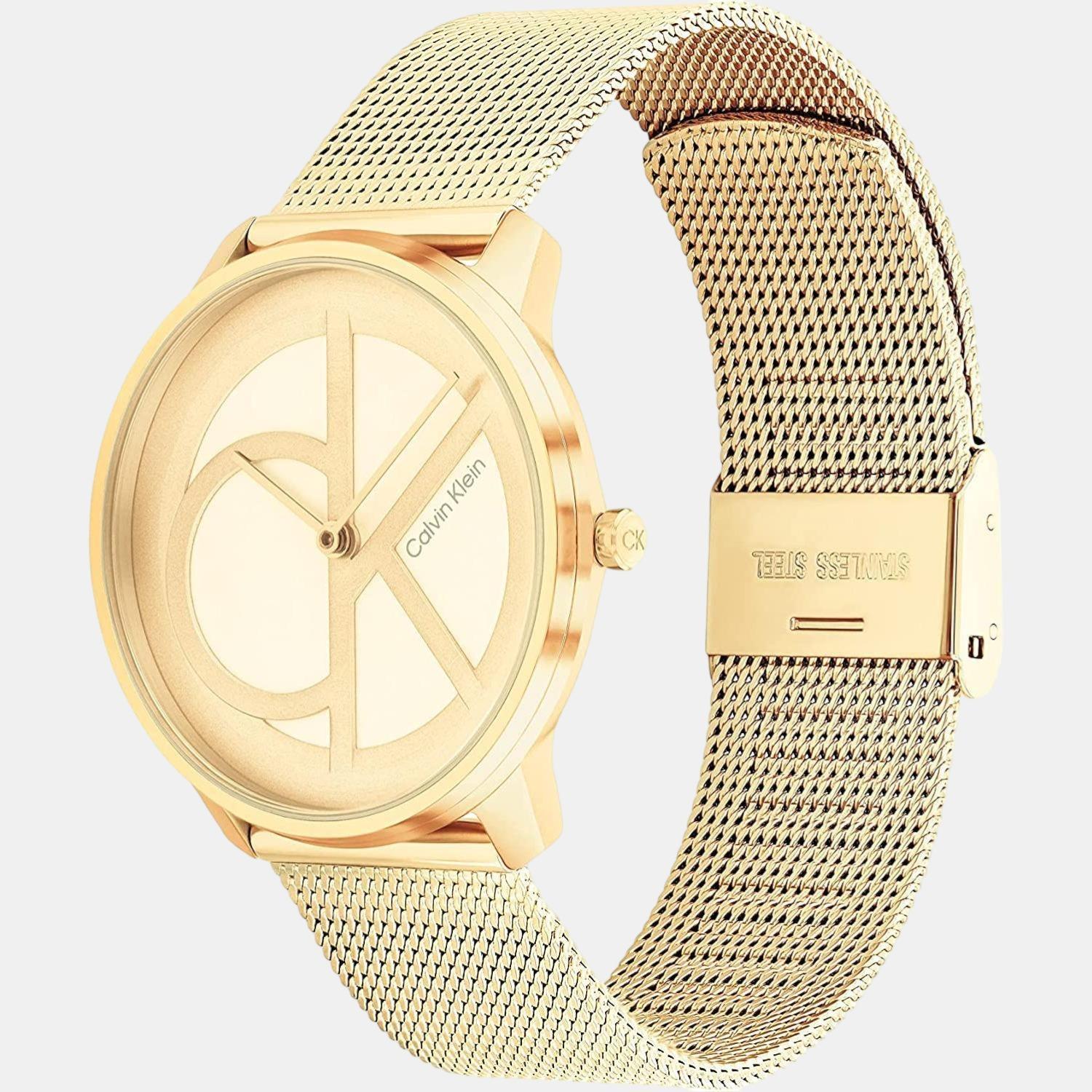 Calvin Klein Stately watch on wrist with gold-tone mesh bracelet and white dial