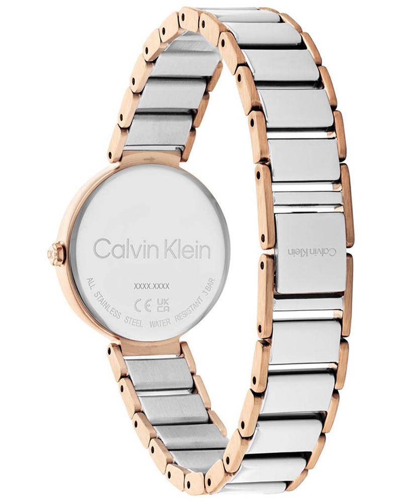 Calvin Klein Stately watch caseback displaying engraved branding and two-tone bracelet detail