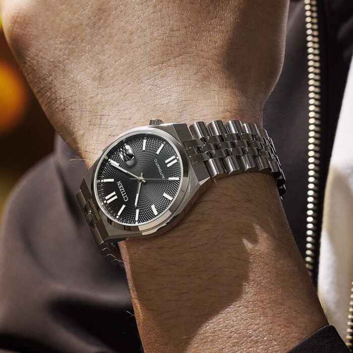 Citizen TSUYOSA automatic watch worn on wrist showing black dial and bracelet