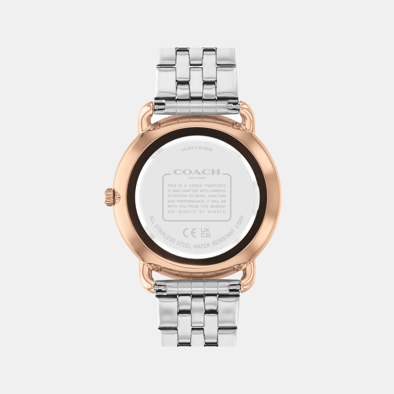 Coach watch caseback showing stainless steel case with engraved text and branding