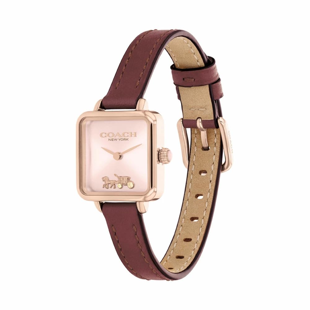 Coach Cass watch at angle showing square case, blush face, and burgundy strap detail