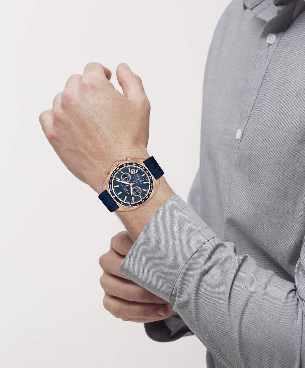 Coach Charter men's chronograph watch worn on wrist with blue strap and rose gold case