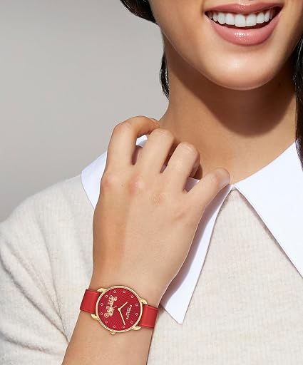Coach Elliot red leather watch worn on wrist showing red dial and gold case