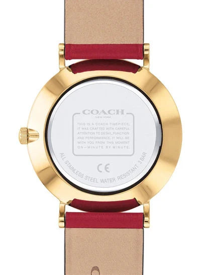 Coach Perry watch caseback showing white dial, gold-tone case, and engraved Coach text