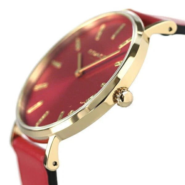 Side view of Coach Perry watch with red leather strap and gold-tone case