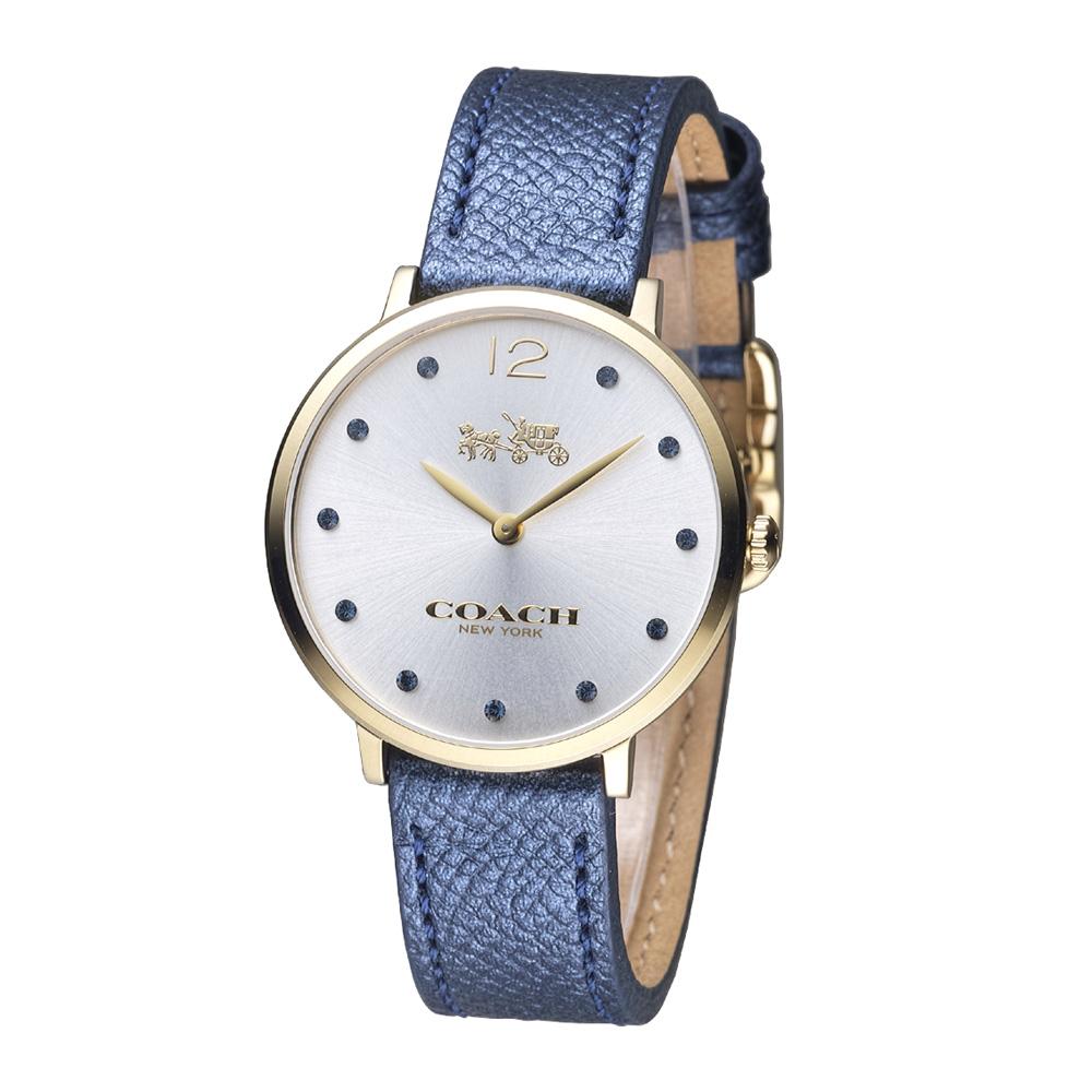 Coach Slim Easton gold women's watch with white dial, Swarovski crystal markers, and navy leather strap