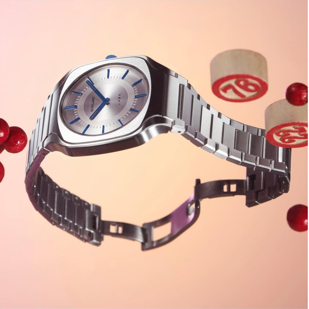 D1 Milano SQBJ01 silver watch with decorative styling and packaging